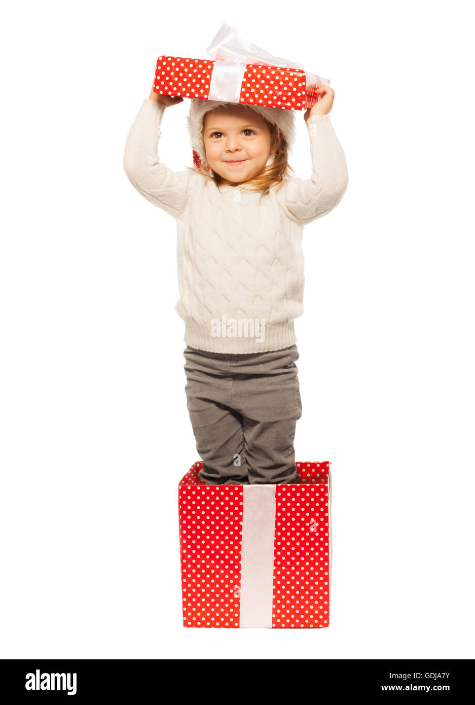 Vorgeben, ein Weihnachtsgeschenk sein glückliches Mädchen Stockfoto