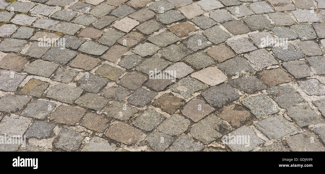 Panorama alten traditionellen europäischen Stil gepflasterten Straße Textur Hintergrund mit Granitblöcken, Stein und Mauerwerk Muster Stockfoto