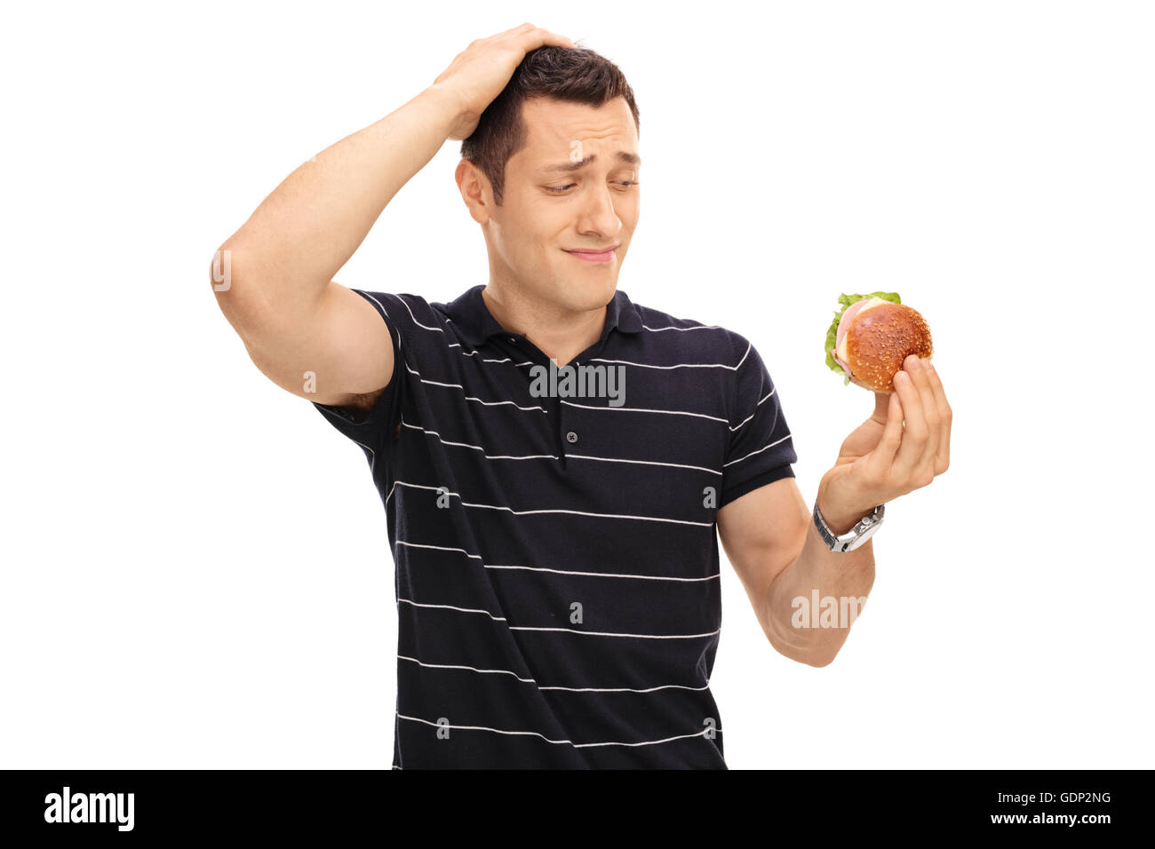 Versucht Mann betrachtet man ein leckeres Sandwich isoliert auf weißem Hintergrund Stockfoto