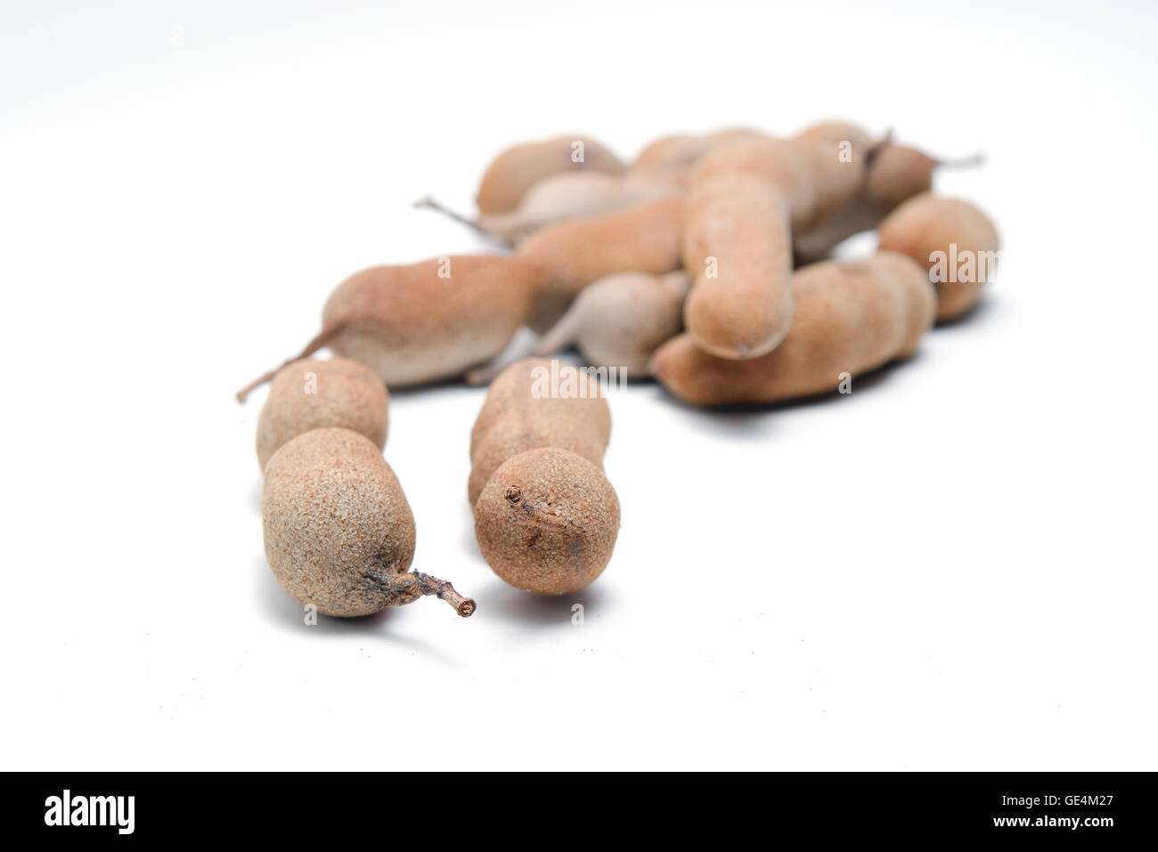 Tamarinde (andere Namen sind baumförmig, Bittermelone, Balsam Apfel, Balsambirne, bittere Gurke, bittere Melone) isoliert Stockfoto