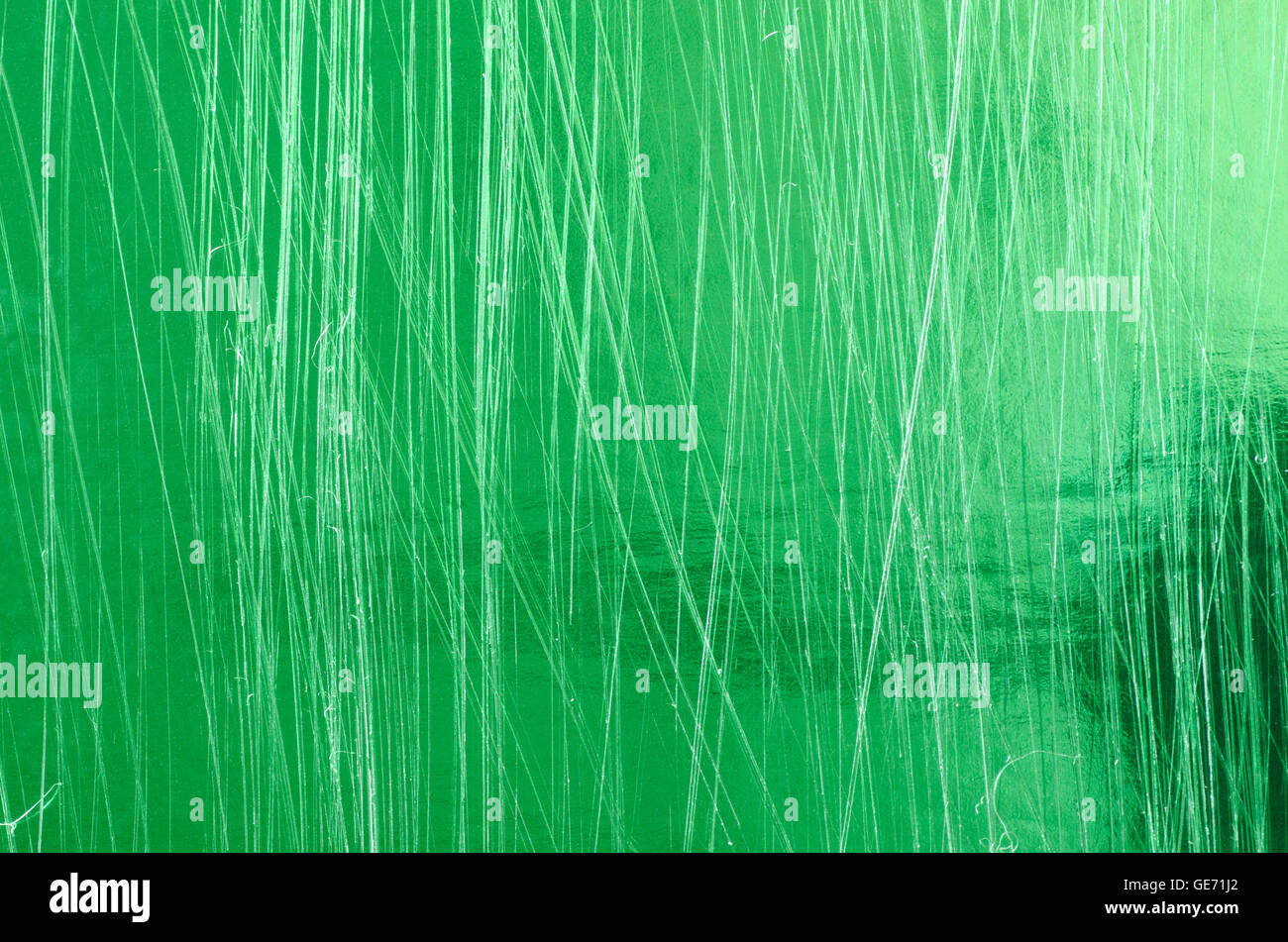 Grün zerkratzt metallic Hintergrundtextur Stockfoto