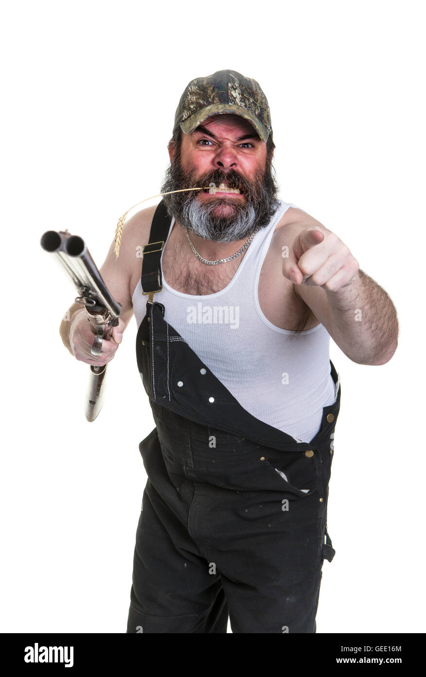 Wütend Hinterwäldler mit Schrotflinte auf einem weißen Hintergrund. Stockfoto