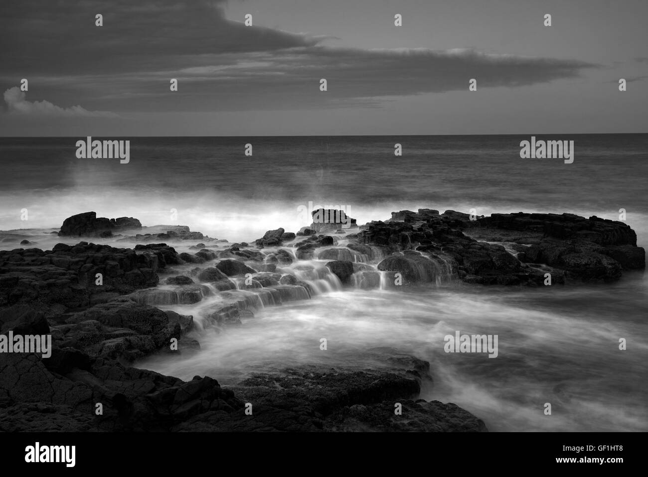 Meereswellen und Sonnenaufgang. South Point. Hawaii (Big Island) Stockfoto