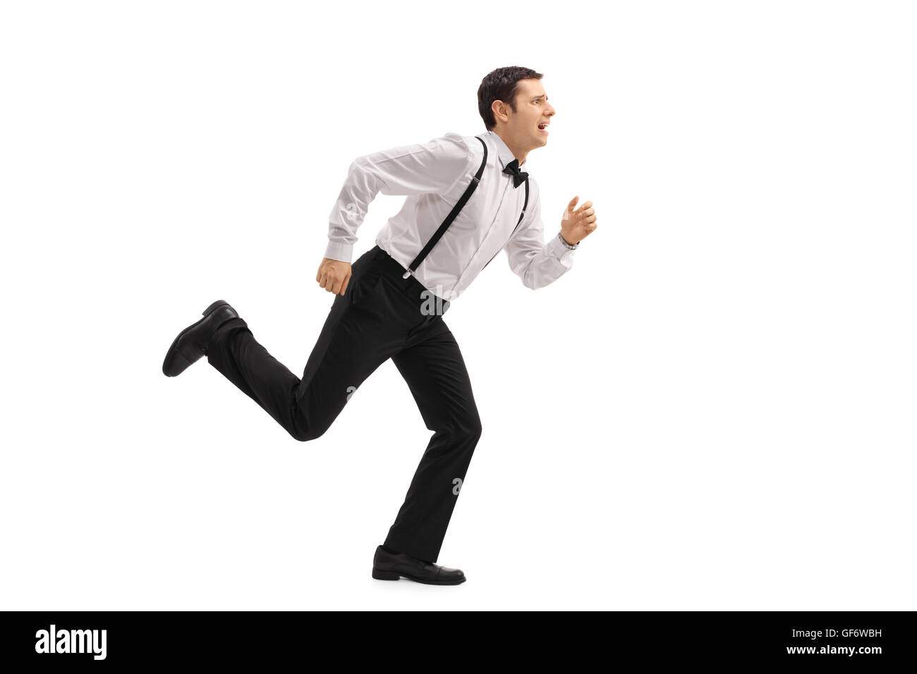 Voller Länge Profil Schuss ein gut gekleideter Mann auf der Flucht vor etwas isoliert auf weißem Hintergrund Stockfoto