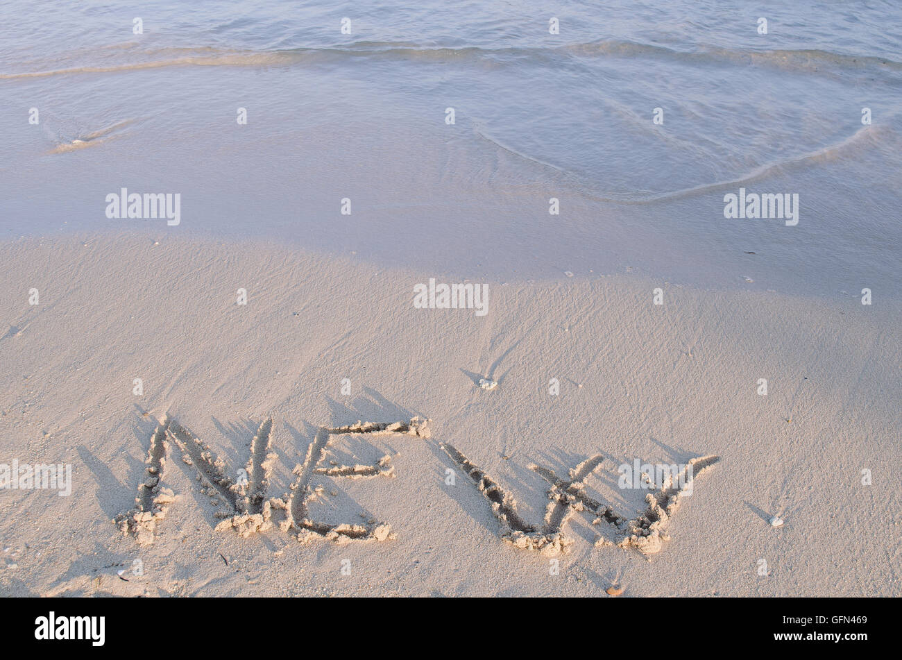 Neu - auf Meer Strandsand gezeichnet Stockfoto