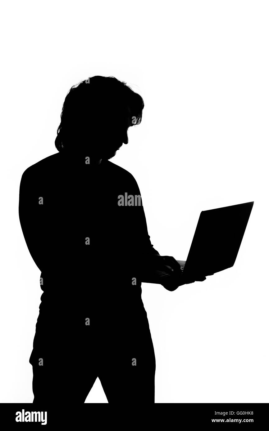 Silhouette eines Mannes mit laptop Stockfoto