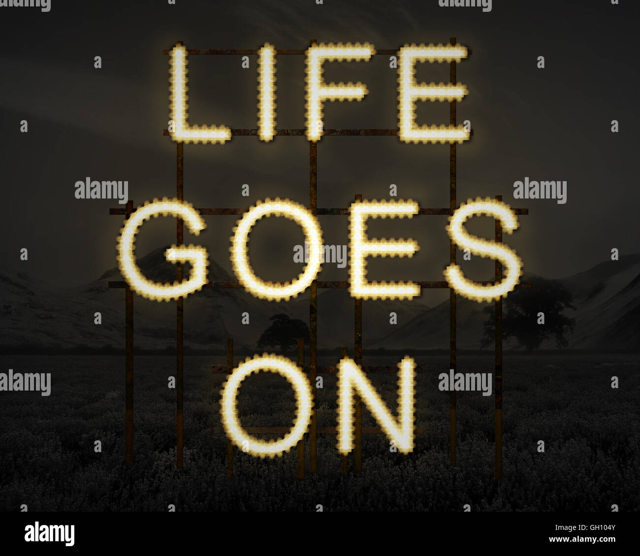 Life Goes On inspirierende Text in Lichter Hintergrund dunkle Landschaft Stockfoto