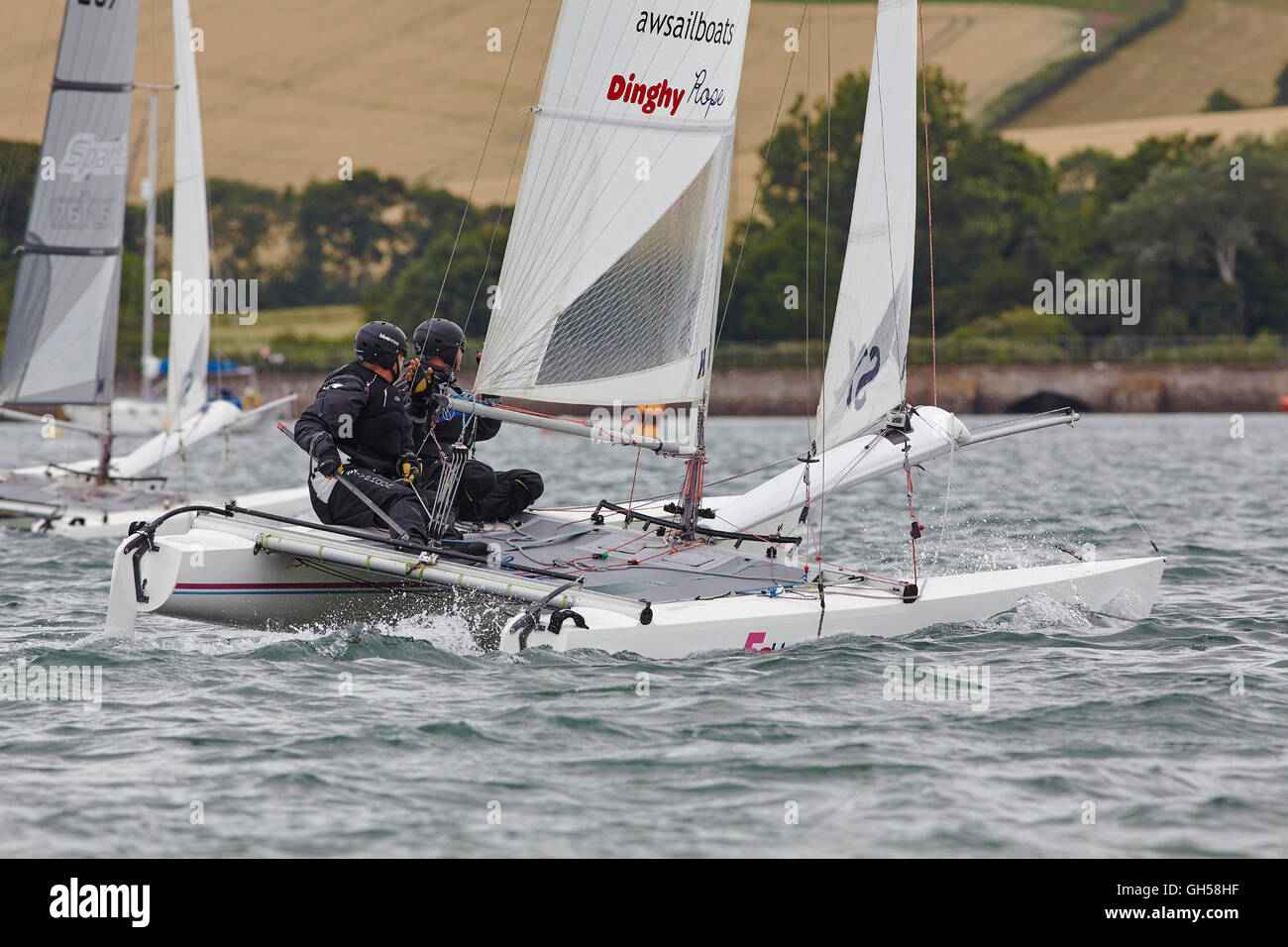 Wettbewerbsfähige Jolle racing in der Mündung des Flusses Exe, Süd Küste von Devon, Südwestengland, Großbritannien. Stockfoto