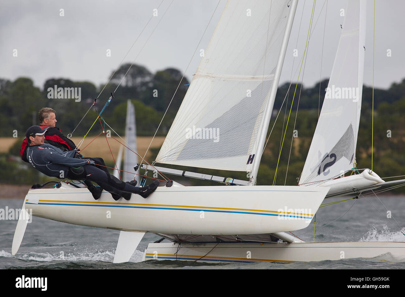 Wettbewerbsfähige Jolle racing in der Mündung des Flusses Exe, Süd Küste von Devon, Südwestengland, Großbritannien. Stockfoto