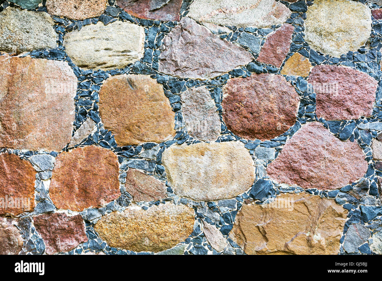 Mauerwerk der bunten Steinen Textur als Hintergrund Stockfoto