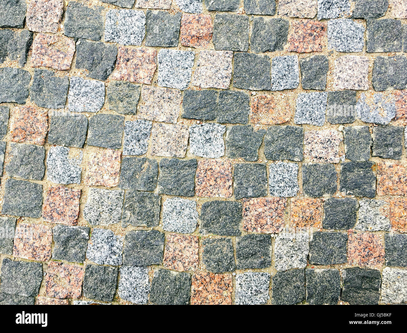 natürliche farbige Granit Stein Straße Bürgersteig Straßenbelag Stockfoto