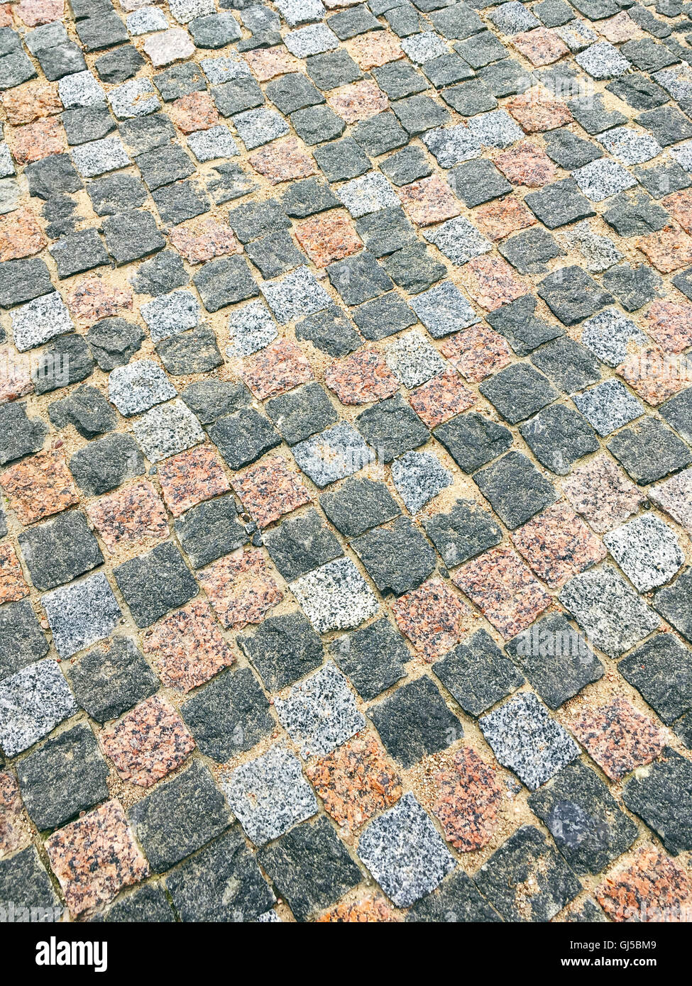perspektivische Ansicht des farbigen Granit Steinen städtischen Bürgersteig Stockfoto