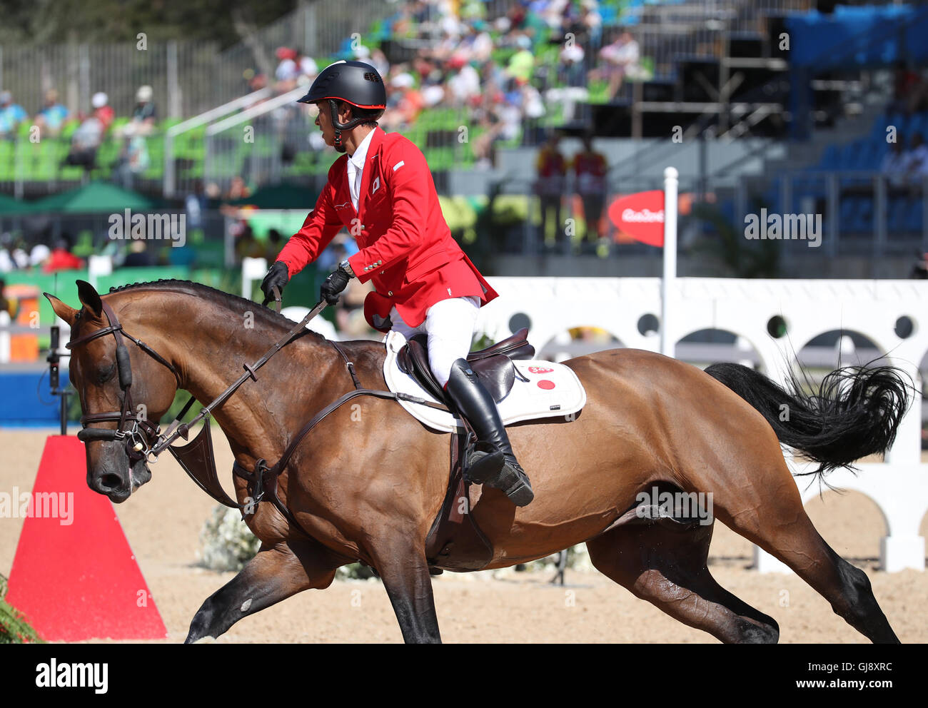 Rio De Janeiro, Brasilien. 14. August 2016. Taizo Sugitani Japans reitet sein Pferd Imothep während der Jumping Team 1. Qualifikation des Pferdesport-Wettbewerbs am Olympic Equestrian Centre während der Rio Olympischen Spiele 2016 in Rio De Janeiro, Brasilien, 14. August 2016. Foto: Friso Gentsch/Dpa/Alamy Live News Stockfoto