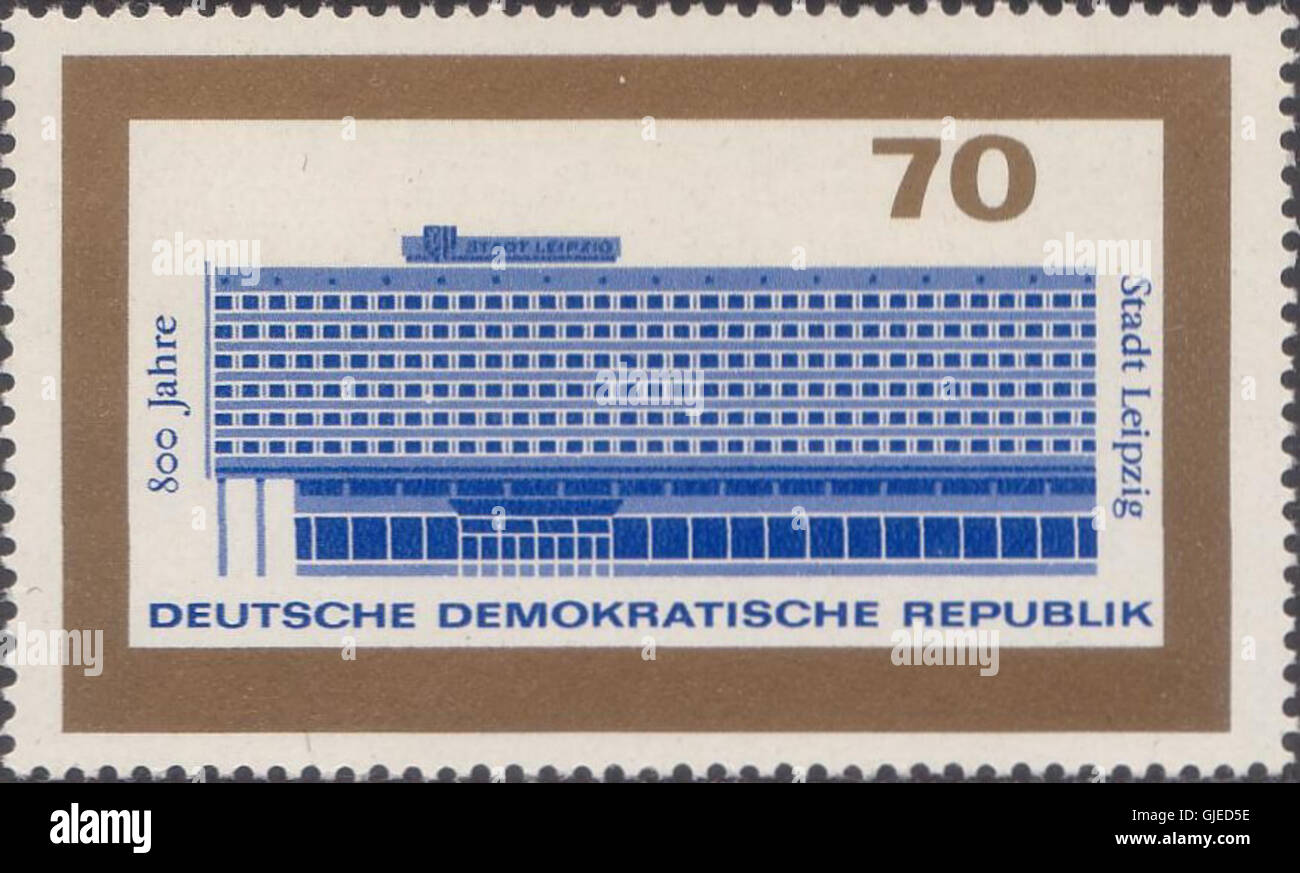 Die 1965 DDR-Marke Michel 1129 zeigt ein Design, das sich auf den Bau der Berliner Mauer bezieht und die Teilung von Ost- und Westdeutschland während des Kalten Krieges symbolisiert. Stockfoto