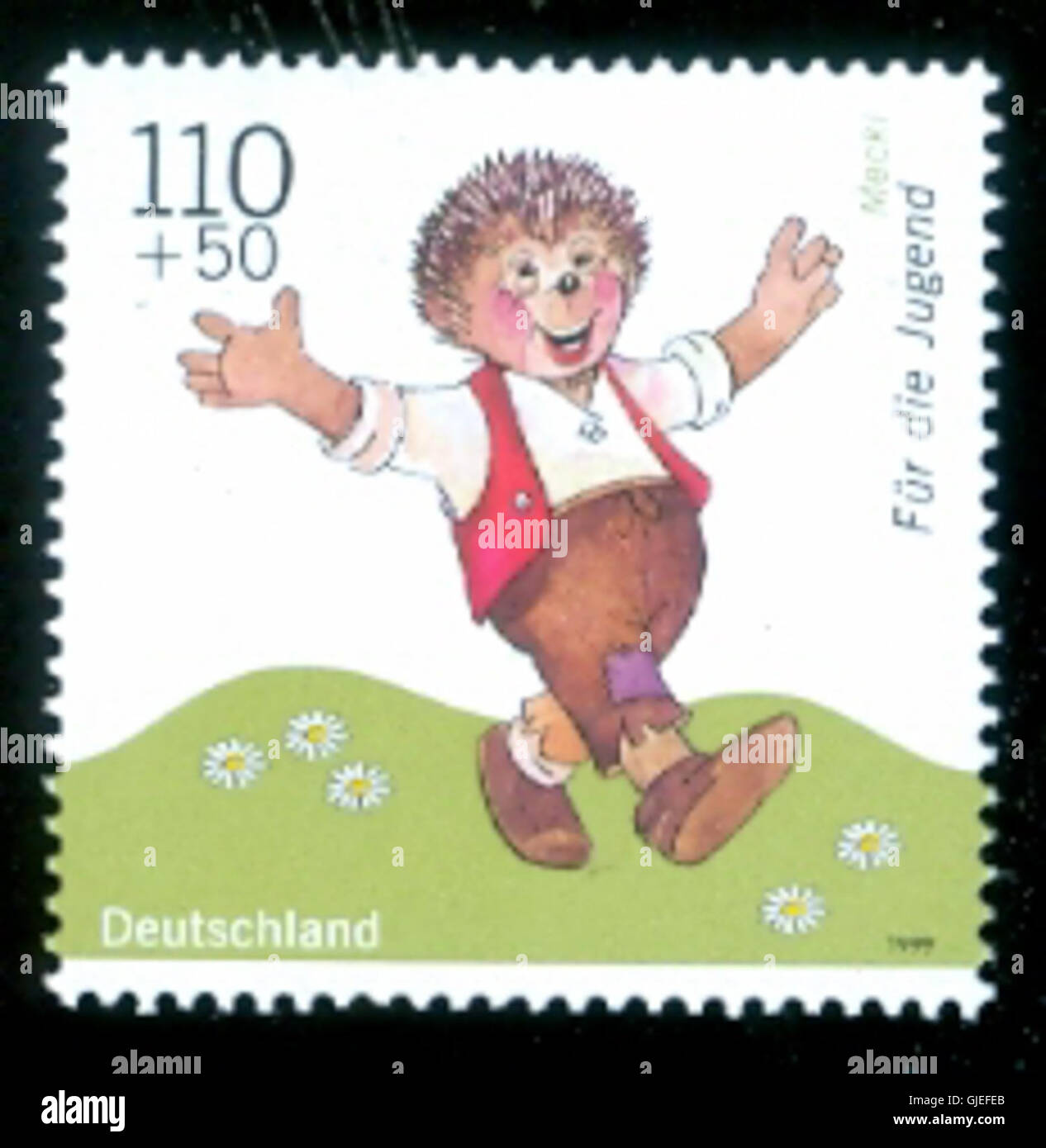 Diese Marke zeigt Mecki, eine beliebte Igelfigur aus der deutschen Literatur, die in einem Portodesign dargestellt ist und einen Stempel trägt. Stockfoto