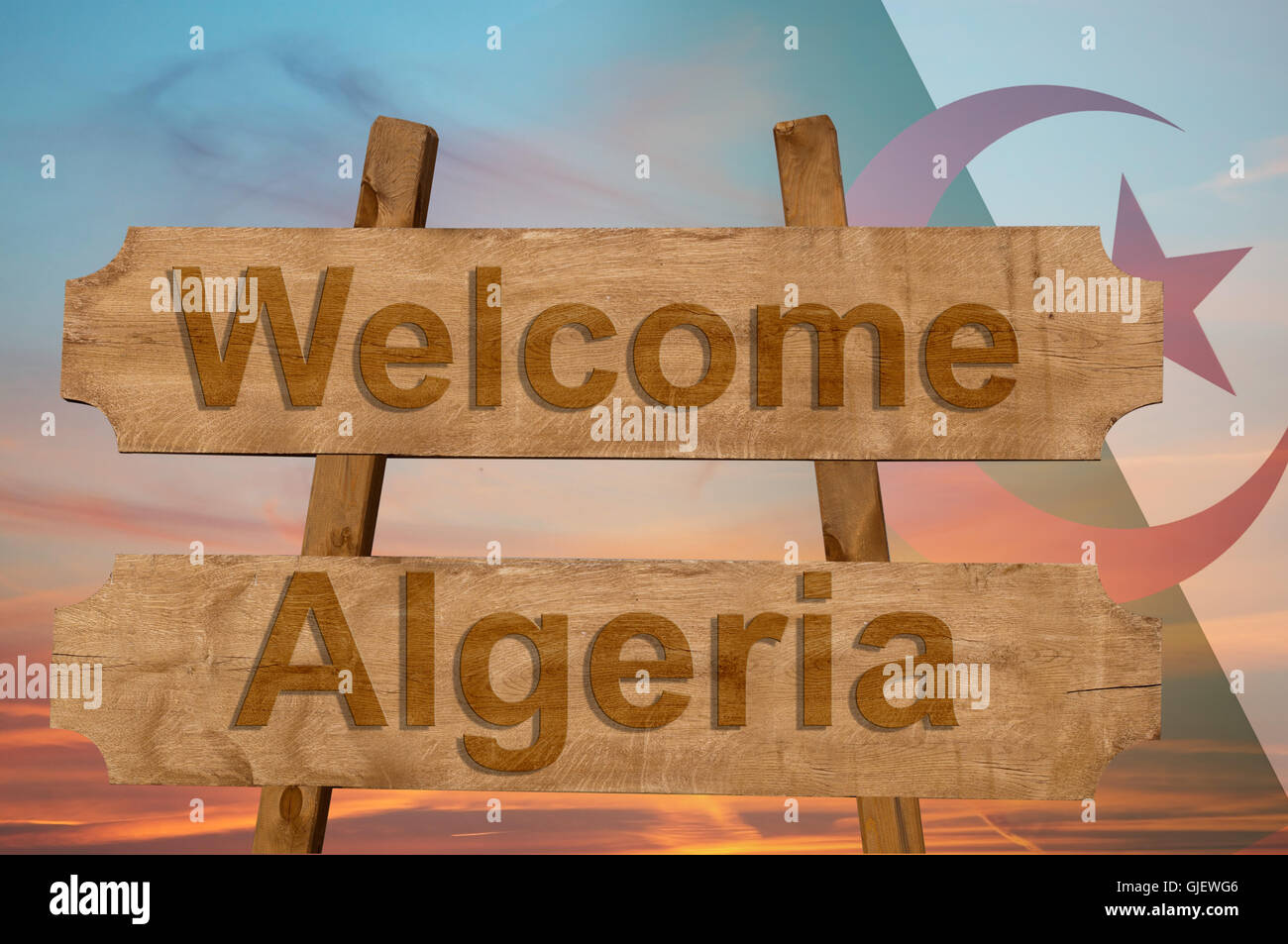 Willkommen in Algerien singen auf Holz Hintergrund mit blending Nationalflagge Stockfoto