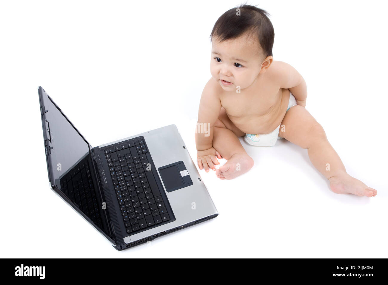 Baby mit laptop Stockfoto