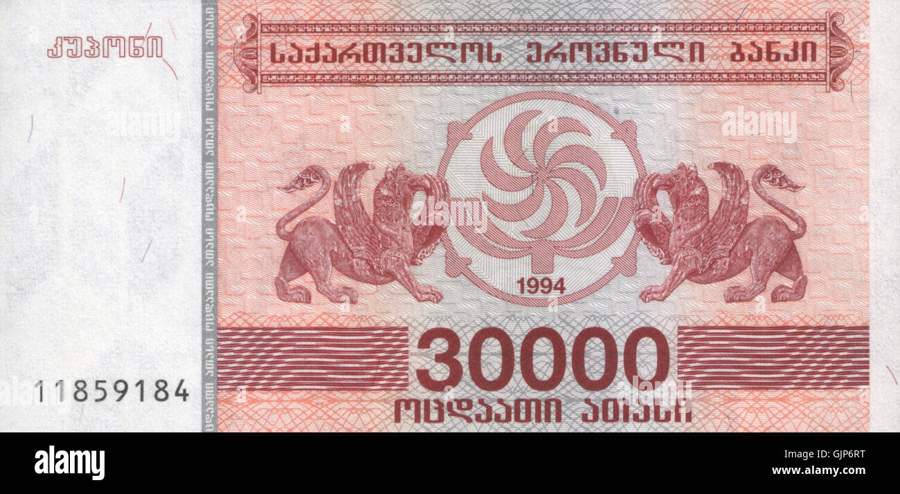 Dieses Bild zeigt einen georgischen Geldschein, einen 30.000 kupon, der 1994 ausgegeben wurde und die wirtschaftliche Instabilität Georgiens nach der Auflösung der Sowjetunion widerspiegelt. Der Kupon wurde als vorübergehende Währung während einer Periode der Hyperinflation verwendet. Stockfoto