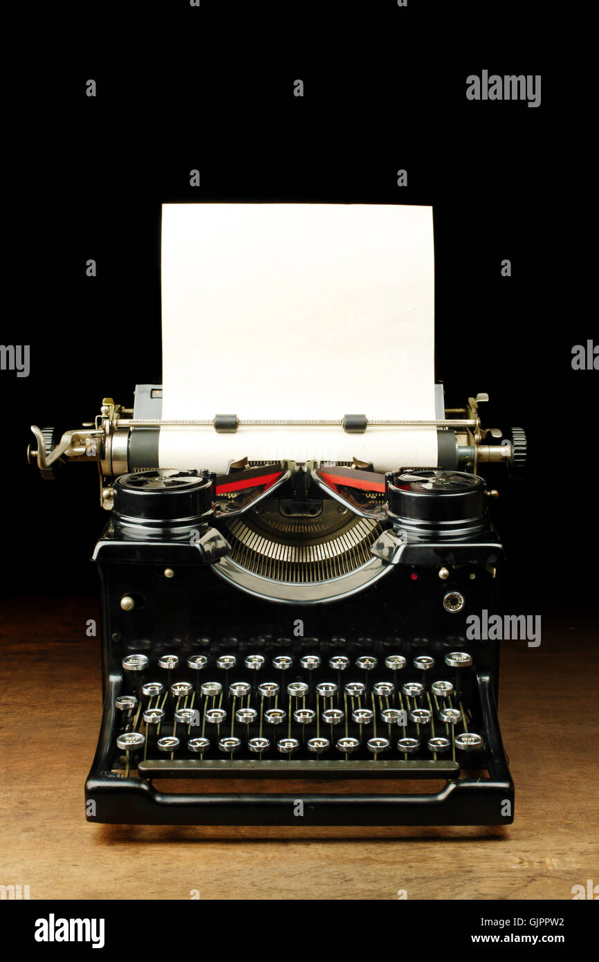 Alte Vintage Schreibmaschine mit leerem Papier Stockfoto