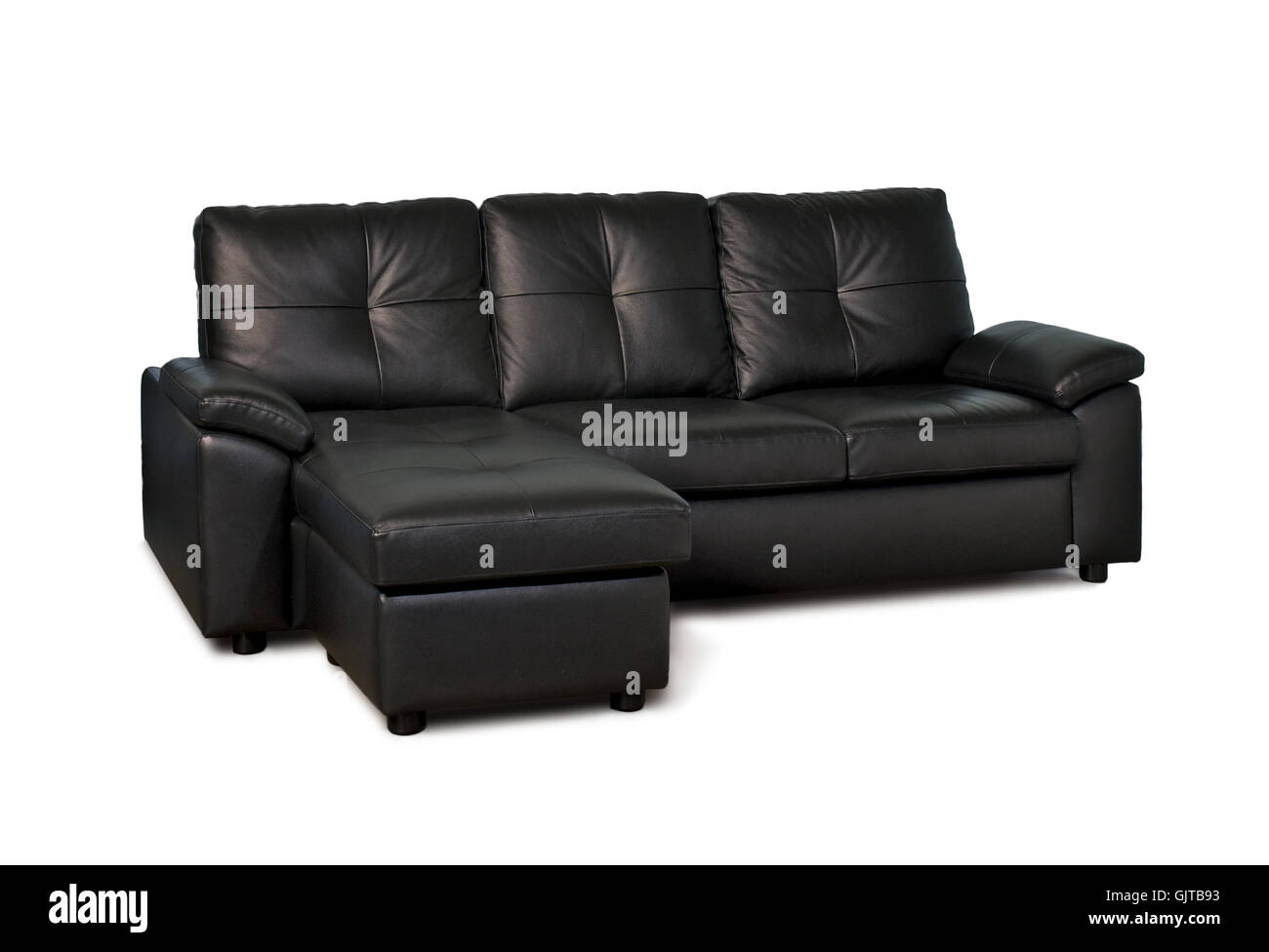 Schwarzes Ledersofa mit Hocker isoliert auf weißem Hintergrund Stockfoto