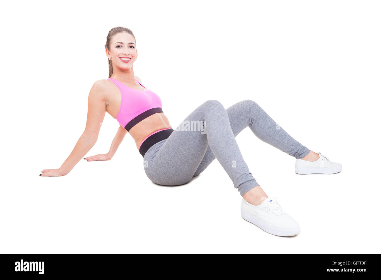 Attraktive Frau tragen Sportbekleidung Festlegung müde nach dem Training isoliert auf weißem Hintergrund mit Kopie Textbereich Stockfoto