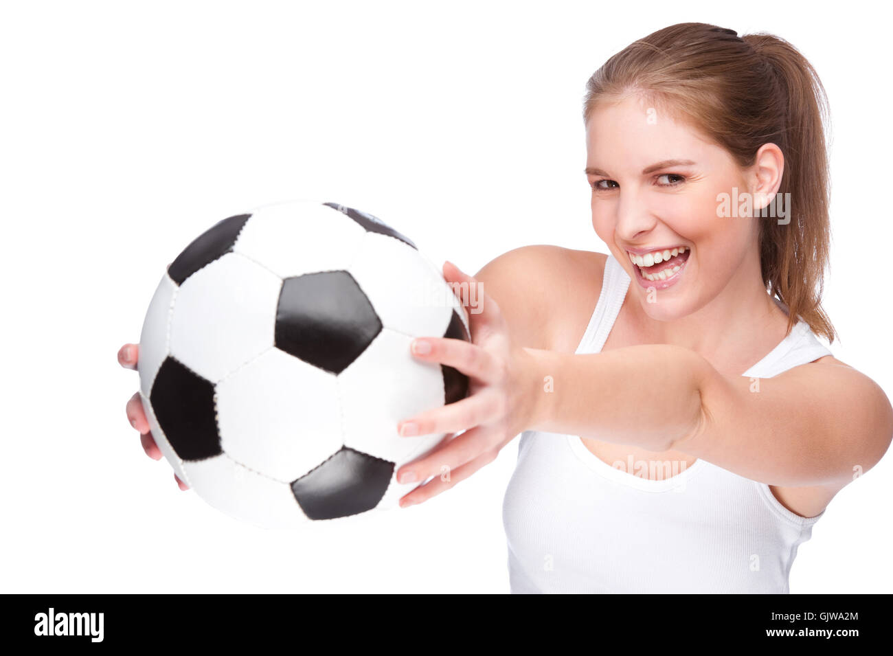 Frau mit einem Fußball Stockfoto