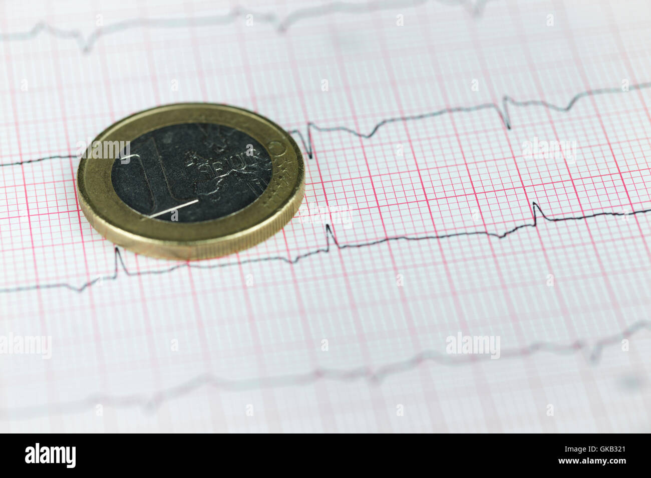 Ein-Euro-Münze über finanzielle Diagramm, Wirtschaft-Konzept Stockfoto