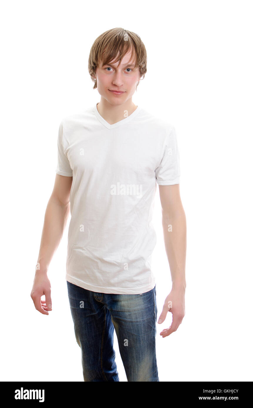 Lässige junger Mann im weißen T-shirt mit Jeans. Isoliert auf weiss. Stockfoto