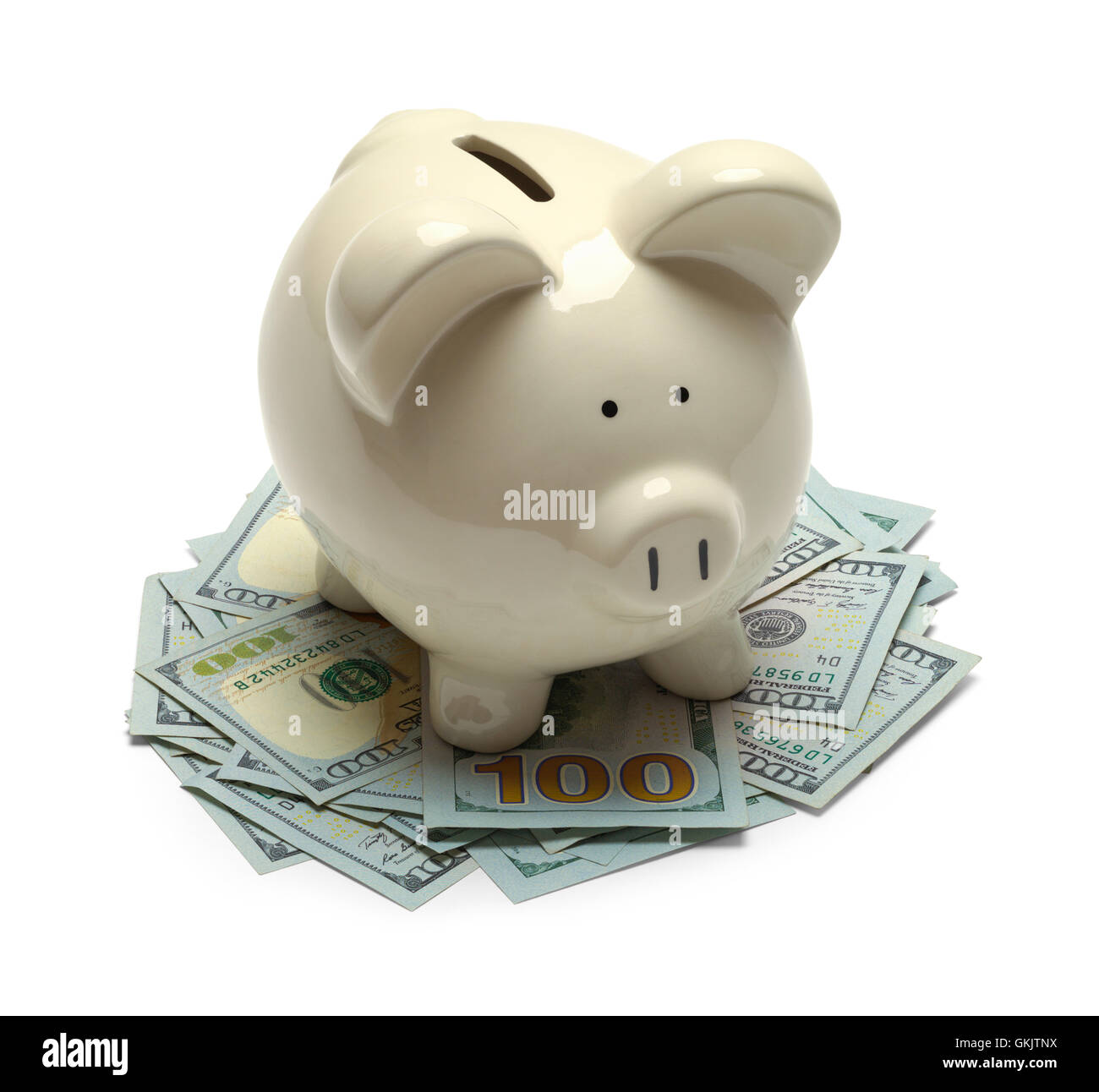 Piggy Bank stehend auf Bargeld, Isolated on White Background. Stockfoto
