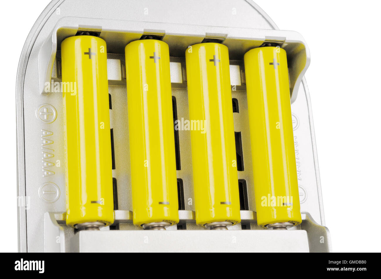 Vier Batterien in das Ladegerät Stockfoto