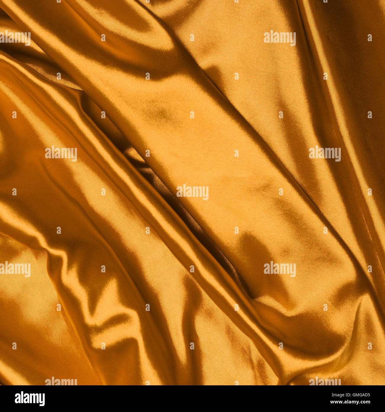 Glatte, elegante Seide Goldgrund Stockfoto