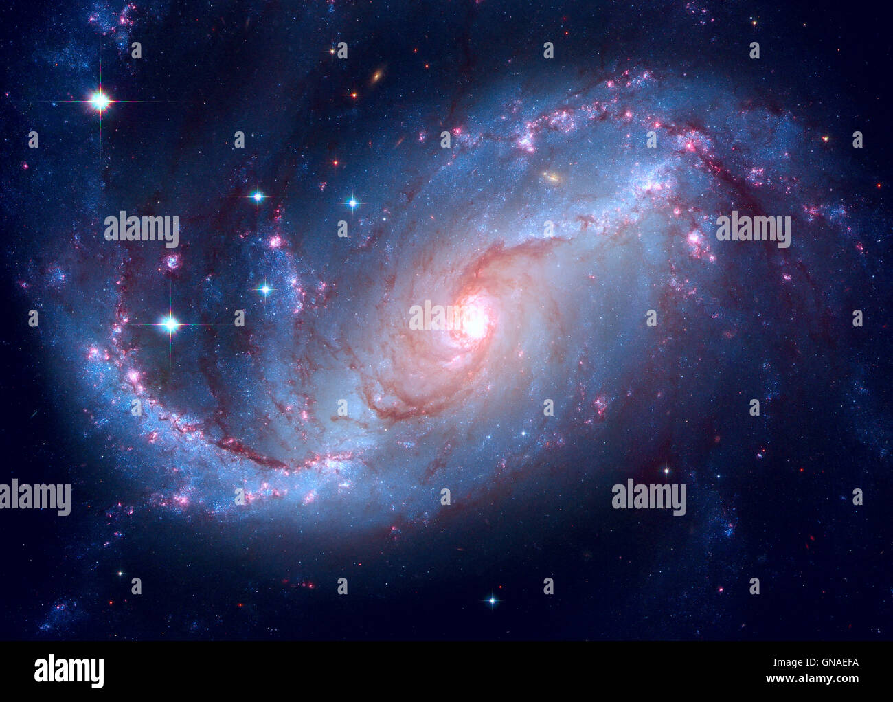 Stellar Nursery in den Armen von NGC 1672. NGC 1672 ist eine vergitterte Spiralgalaxie im Sternbild Dorado gelegen. Stockfoto Stellar Nursery in den Armen von NGC 1672. NGC 1672 ist eine vergitterte Spiralgalaxie im Sternbild Dorado gelegen. Stockfoto