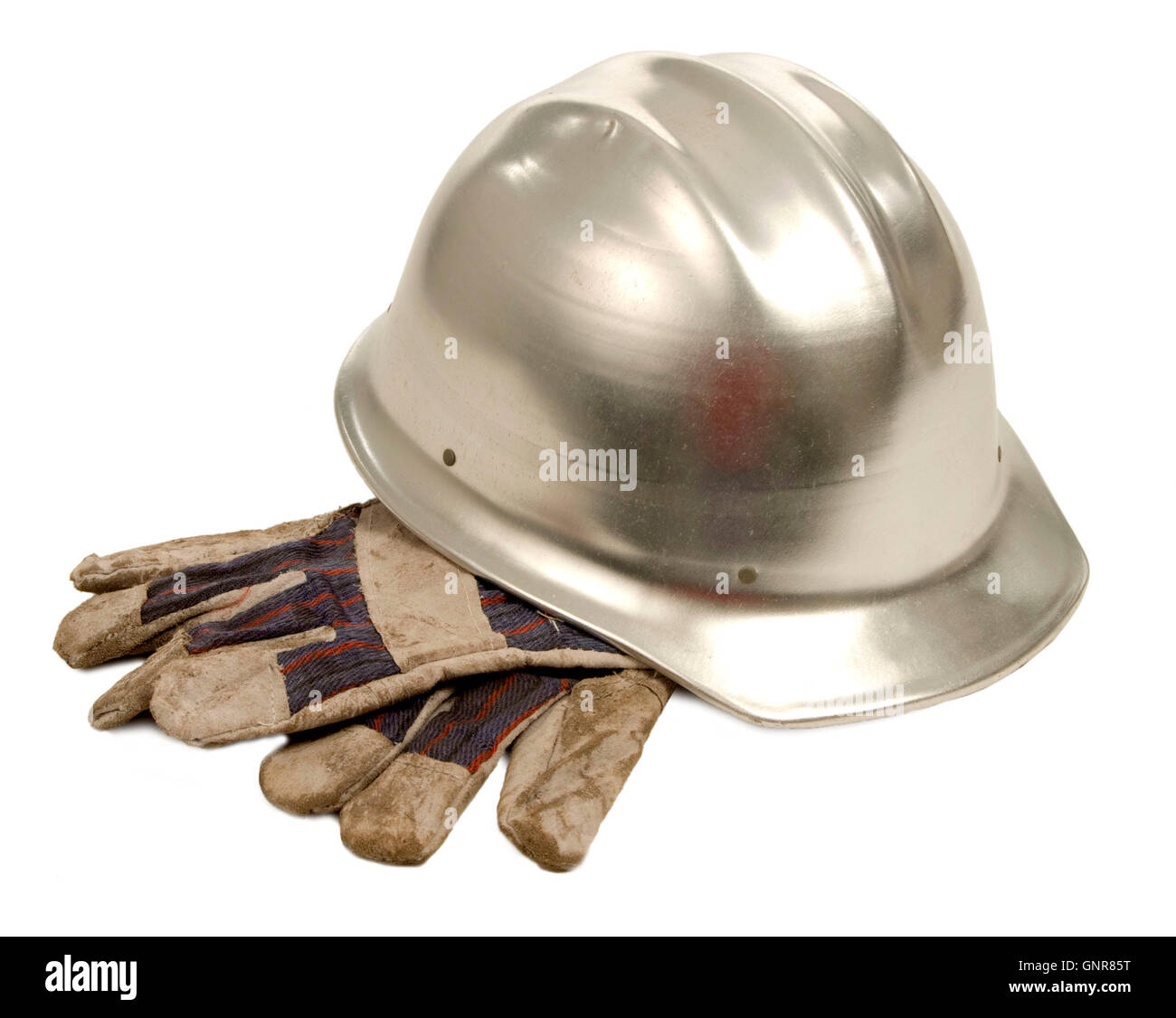 Bauarbeiterhelm und Handschuhe Stockfoto