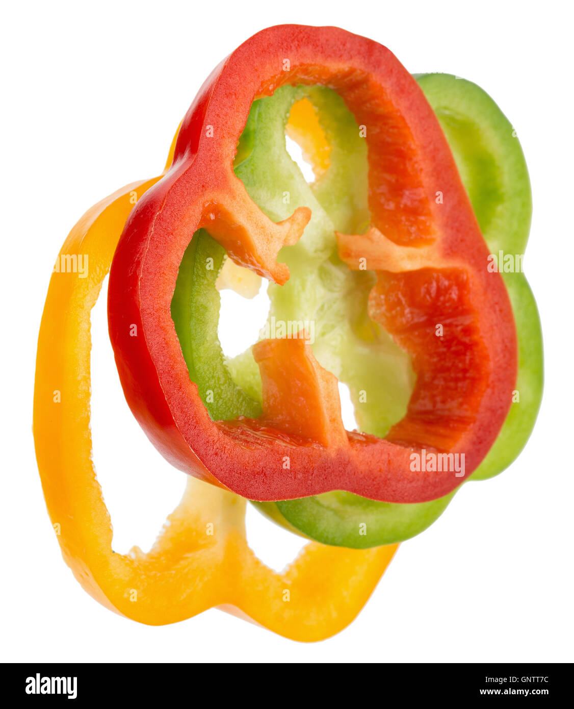 rote, grüne und gelbe Paprika Scheiben auf dem weißen Hintergrund isoliert. Stockfoto