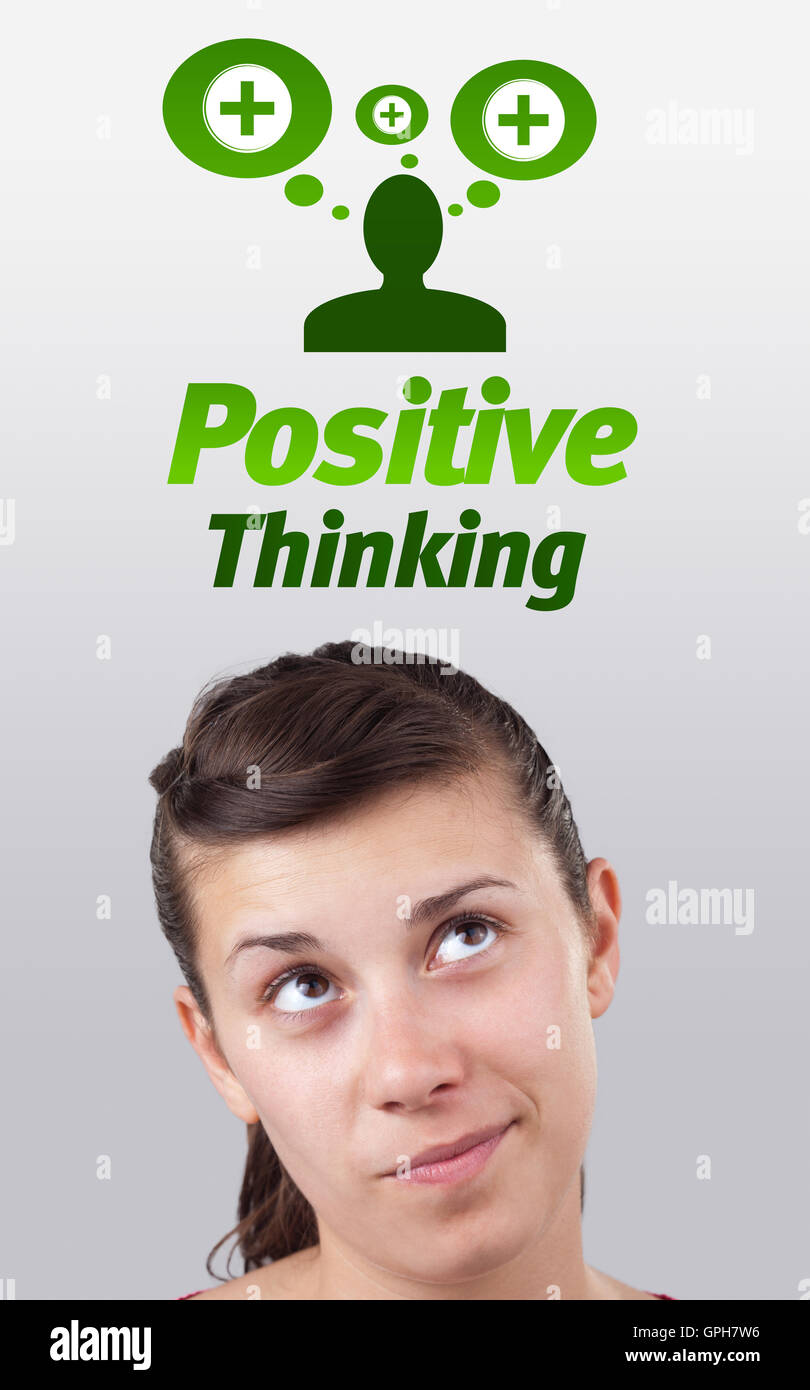 Junges Mädchen Blick auf positive und negative Zeichen Stockfoto