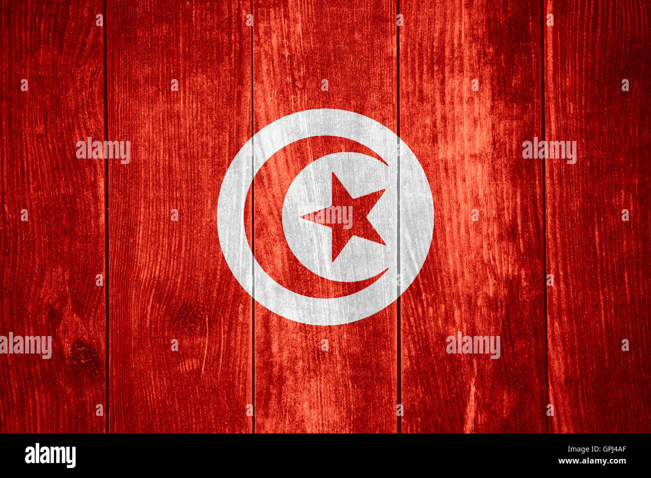 Flagge von Tunesien oder tunesische Banner auf hölzernen Hintergrund Stockfoto