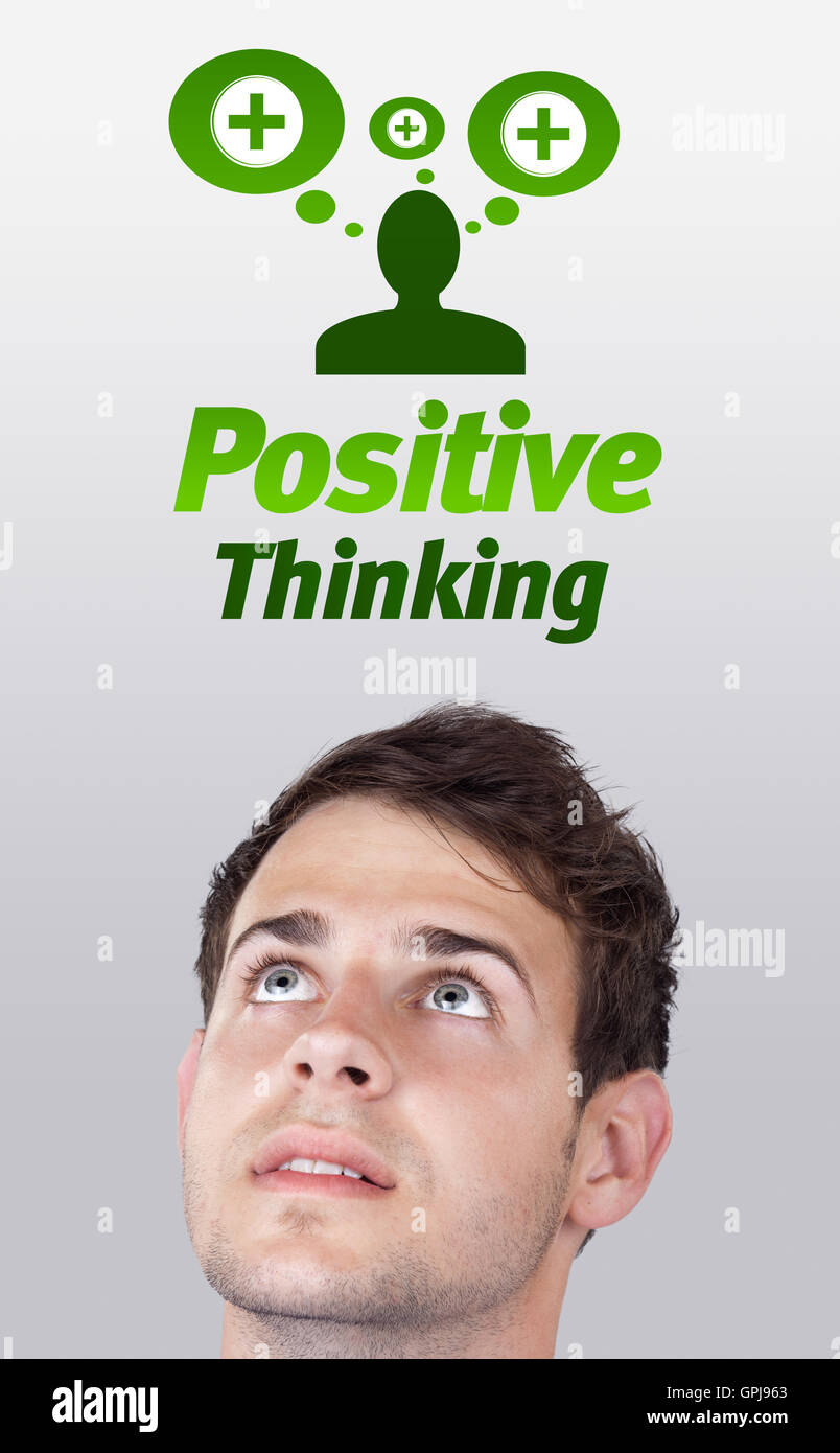 Junge Kopf Blick auf positive und negative Zeichen Stockfoto