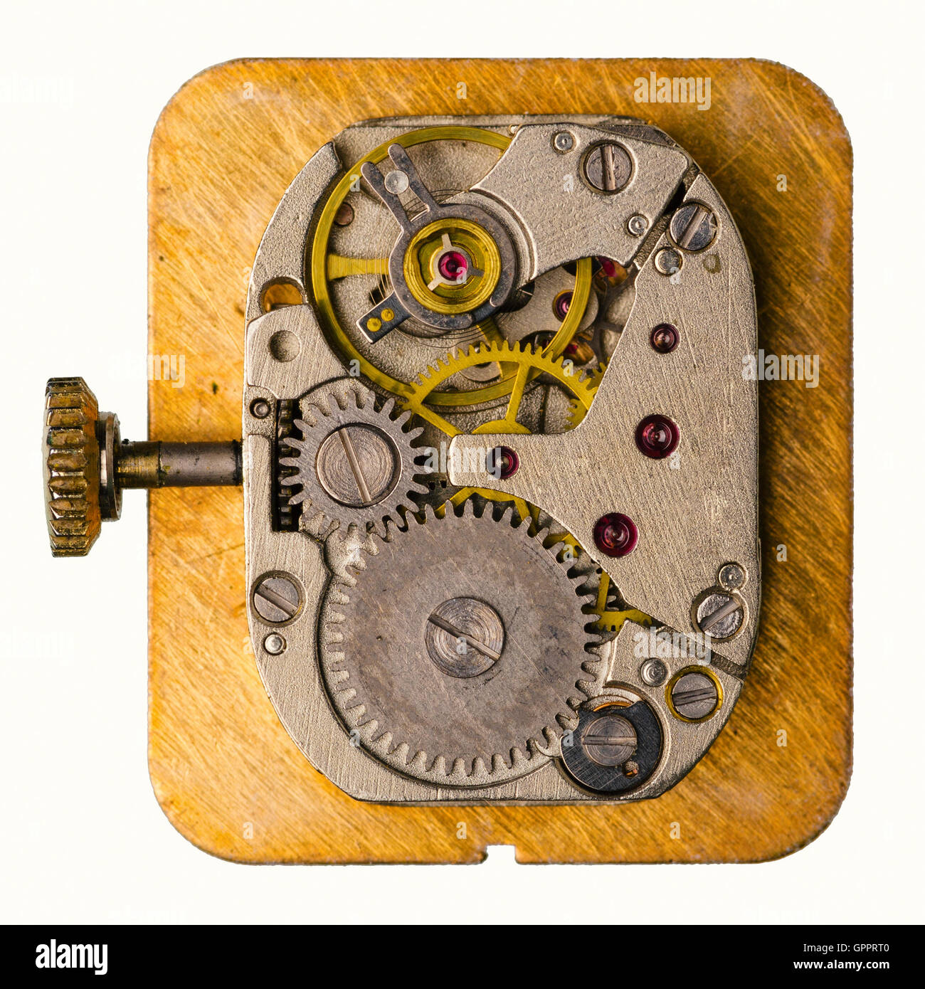 Altes Uhrwerk auf weißem Hintergrund mit goldenen Rädern. Makroaufnahme. Stockfoto