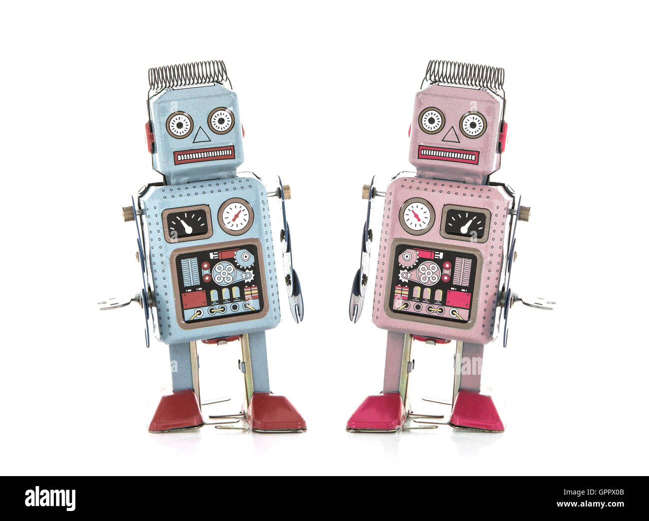 Boy und Girl Retro-Zinn-Roboter auf einem weißen Hintergrund Stockfoto