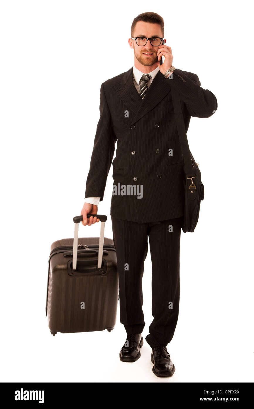Erfolgreicher Geschäftsmann in formellen Anzug und Aktenkoffer gehen auf Geschäftsreise über weißen isoliert. Stockfoto