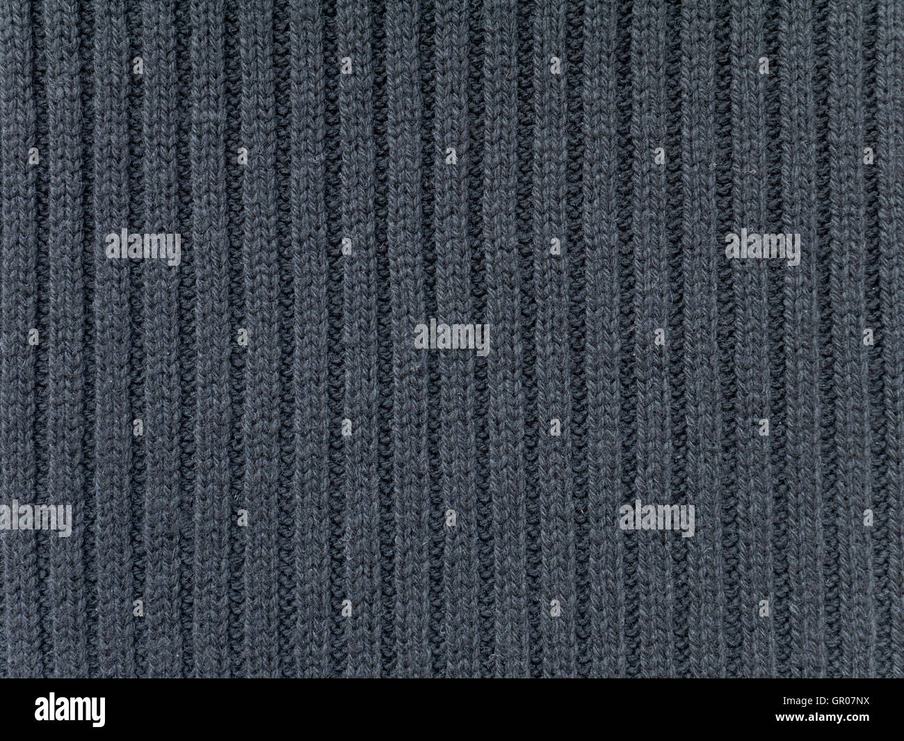 Dunkles grau gerippt gestrickter Wolle Stoff kühles Wetter Hintergrund Stockfoto