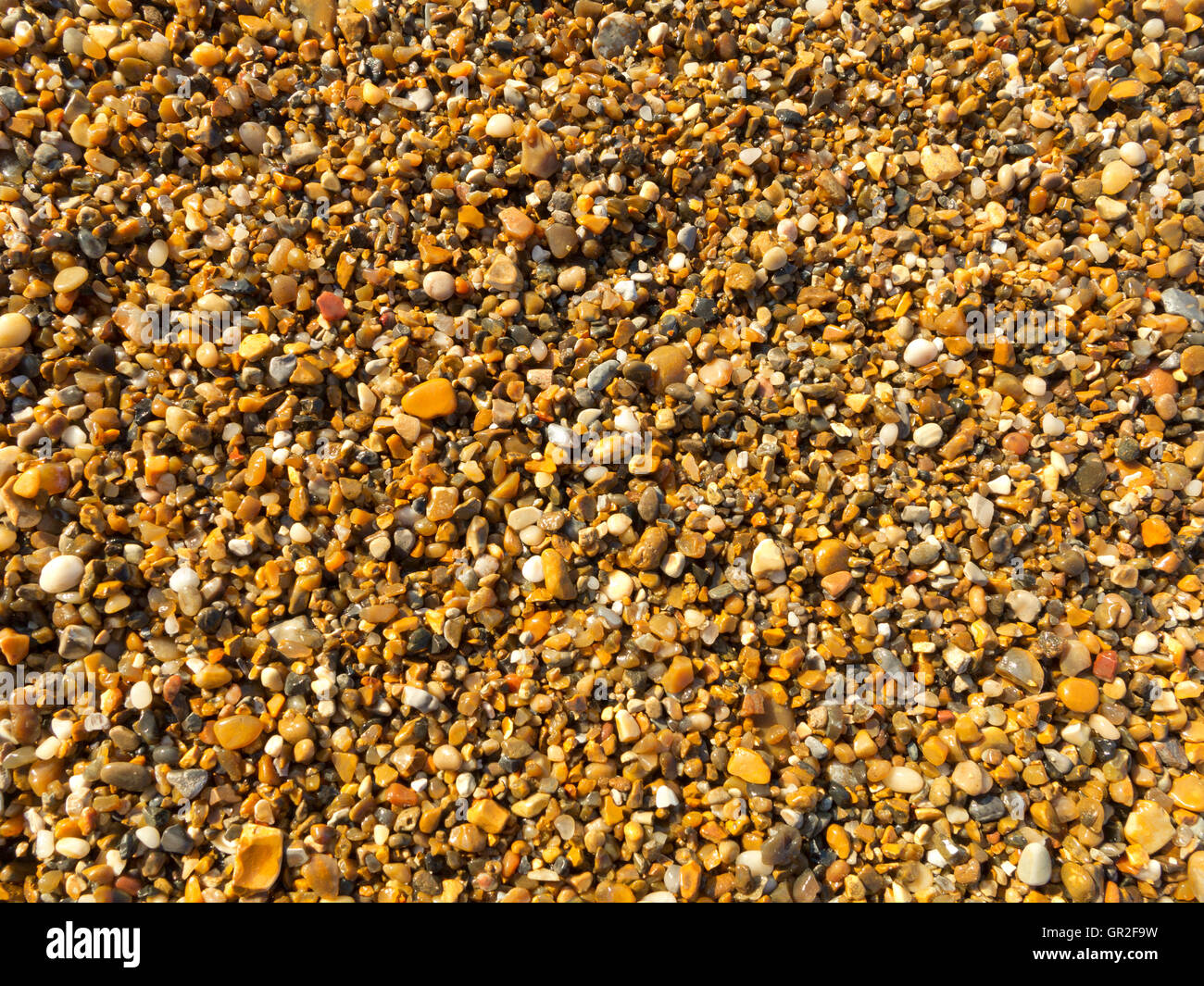 Einen flachen Overhead Schuss von kleinen Strand Kieselsteine Stockfoto