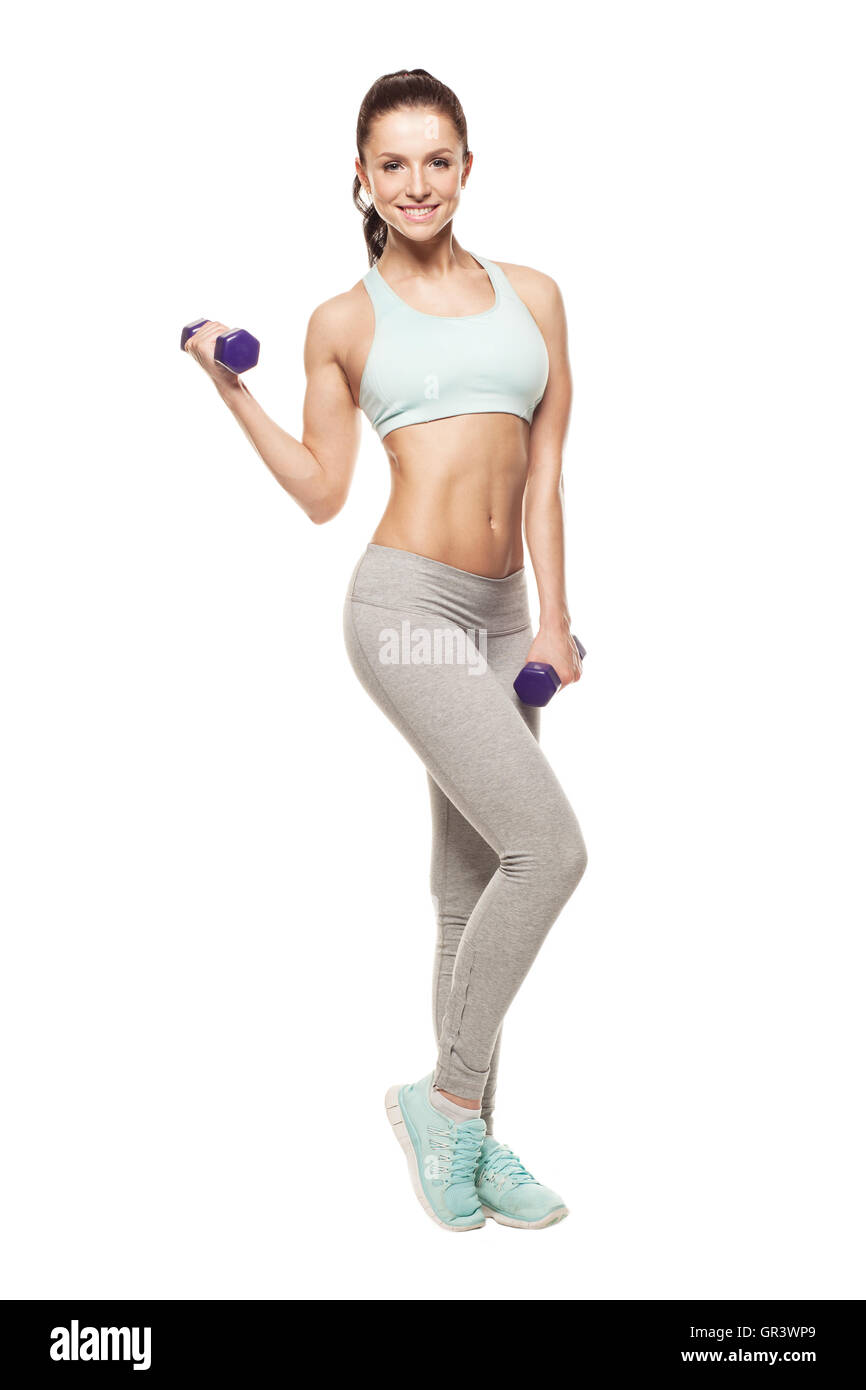 sportliche Frau tun ihr Workout mit Hanteln, isoliert auf weißem Hintergrund Stockfoto