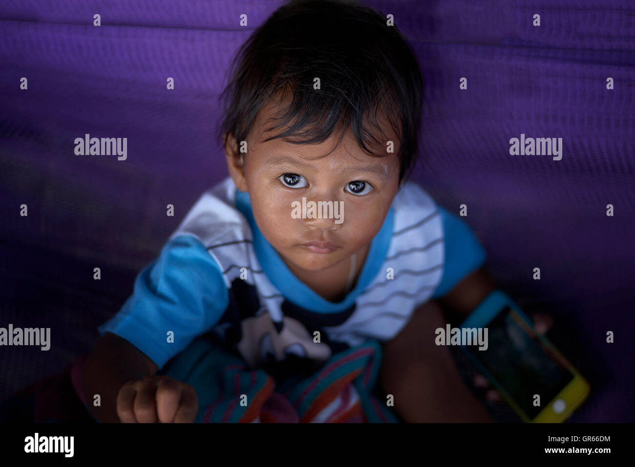 Kind mit breitem Augen. Thailand S. E. Asien Stockfoto