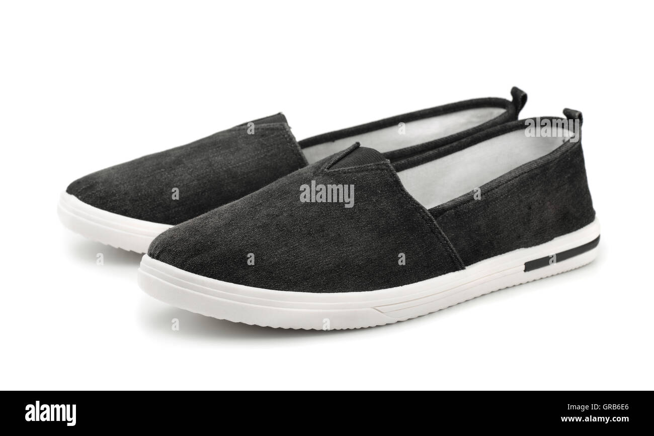 Paar schwarze Leinwand Slip-on-Freizeitschuhe isoliert auf weiss Stockfoto
