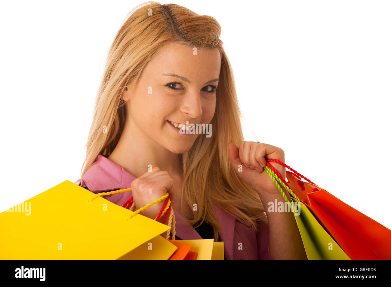 Cute blonde Frau mit lebendigen Einkaufstaschen isoliert auf weißem Hintergrund Studio gedreht Stockfoto