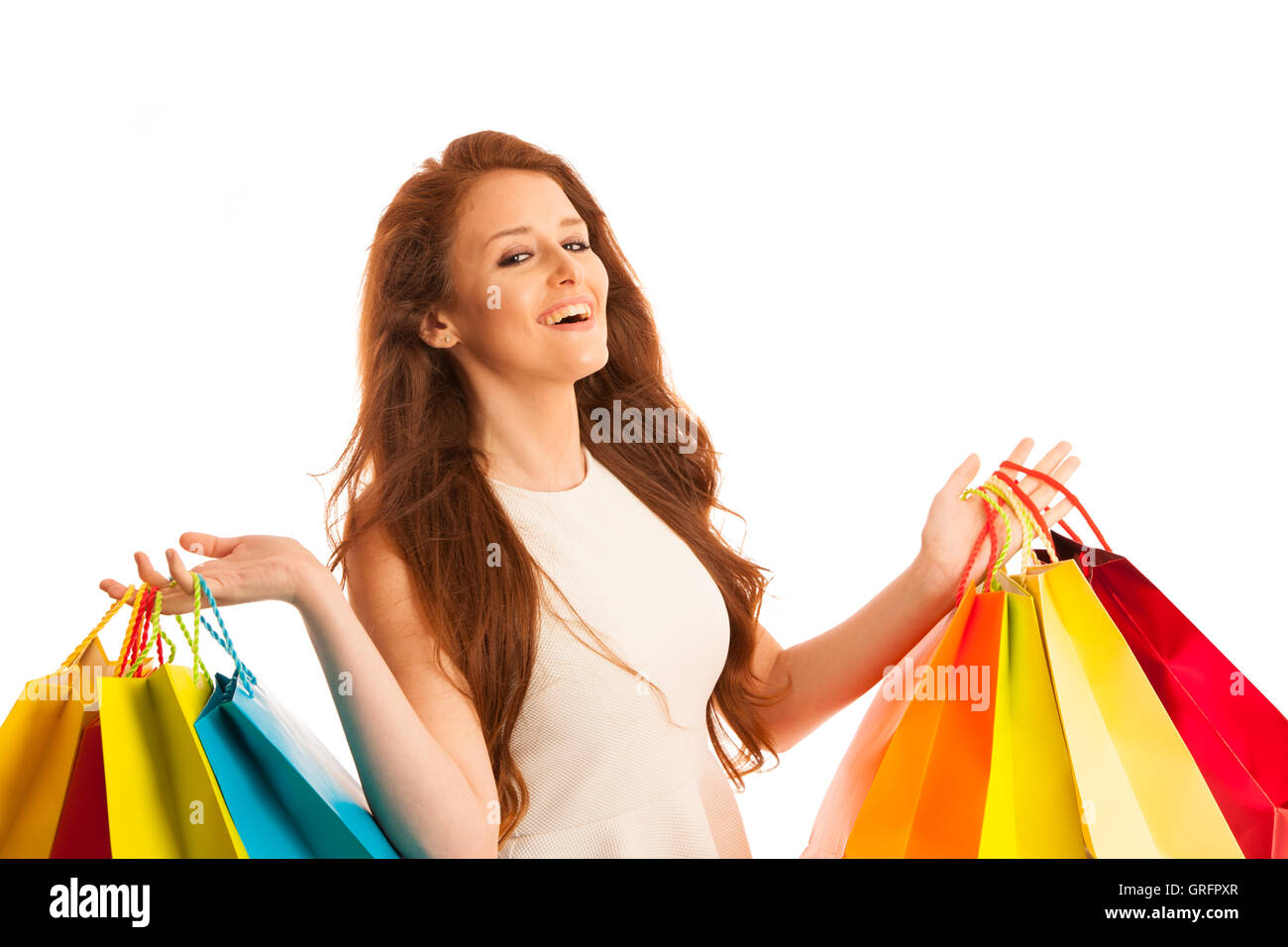 Frau mit Einkaufstüten nach einem erfolgreichen Kauf für den Verkauf über weißen isoliert Stockfoto