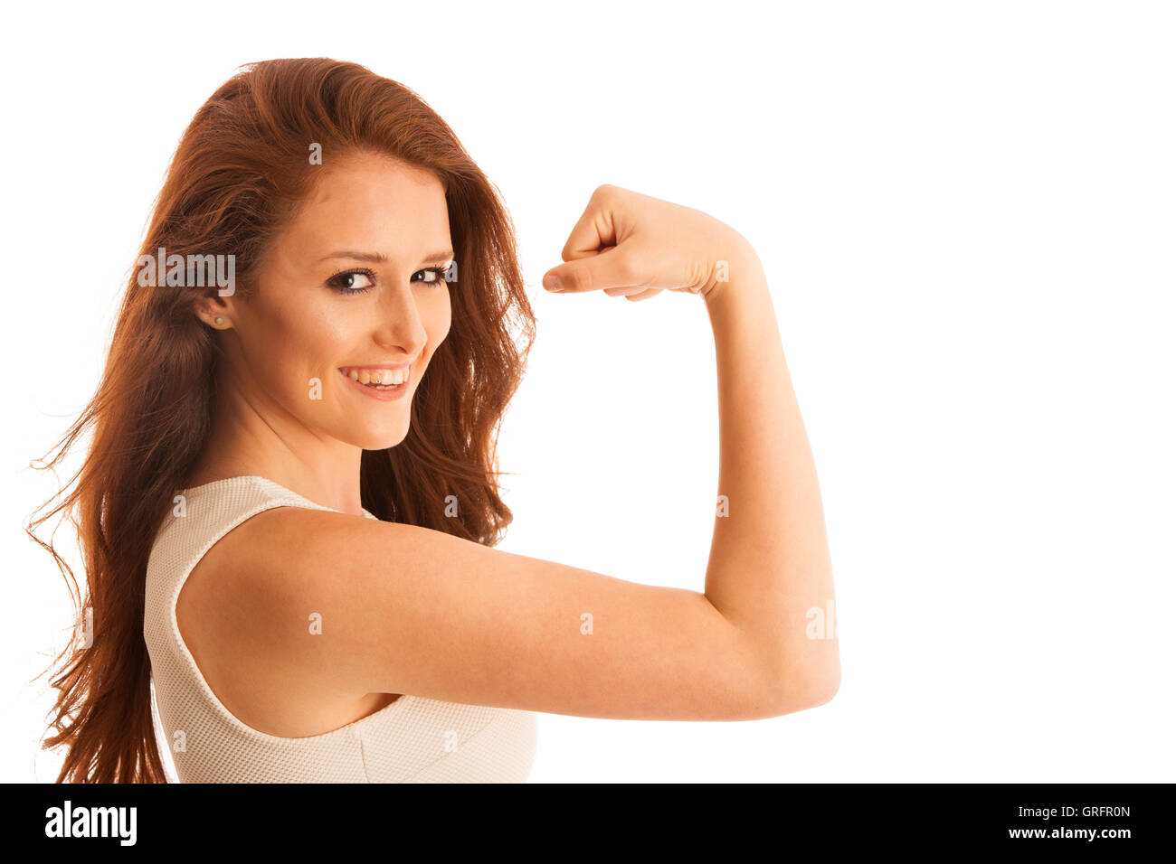 Frau zeigt ihren Arm als Geste für Strrength isoliert auf weiß Stockfoto