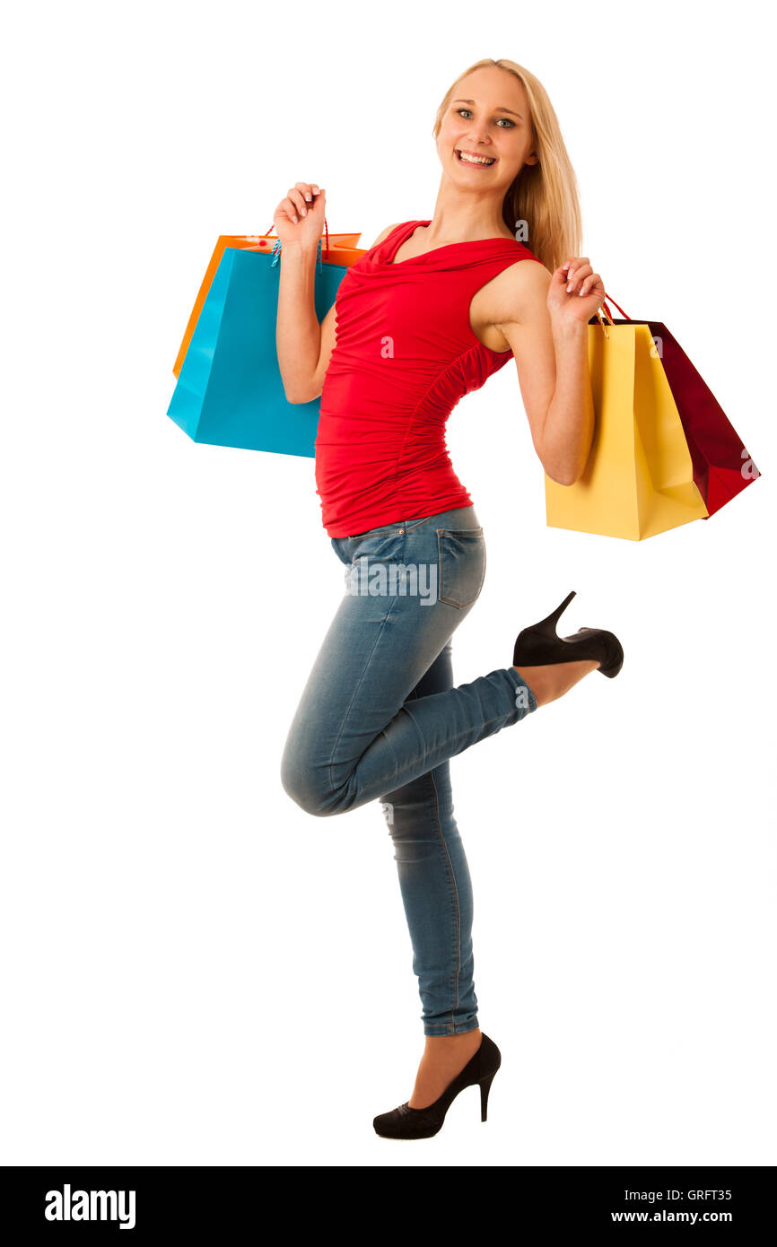 Schöne junge Frau mit Einkaufstüten Konsum über weiße Backgeeound isoliert Stockfoto