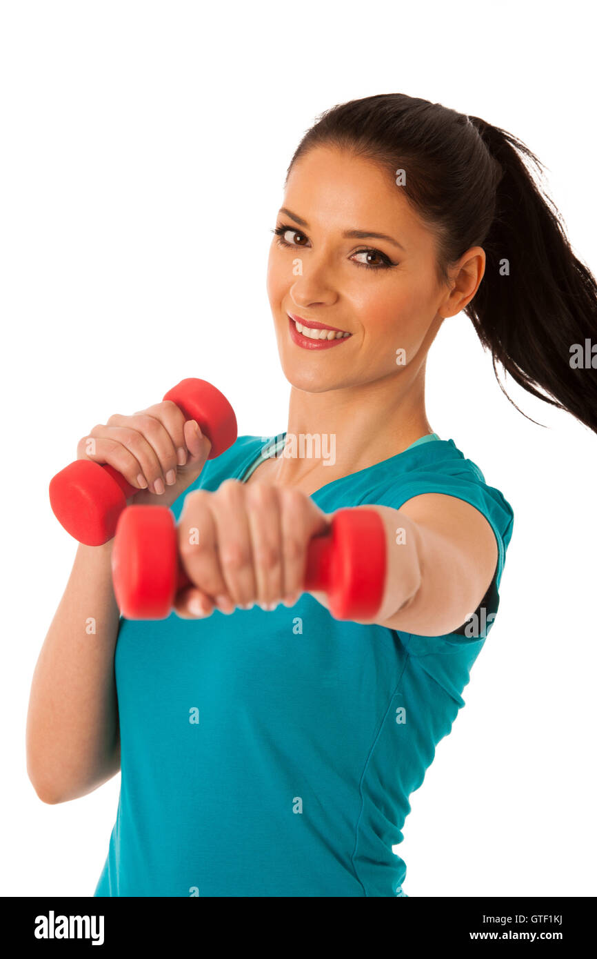 aktive Frau mit Hanteln trainieren Sie im Fitness-Studio, die isoliert auf weißem Hintergrund Stockfoto